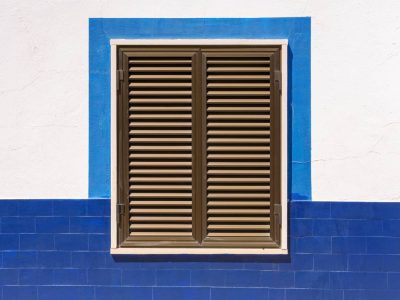 Closed wooden window shutters of an typical mediterranean house