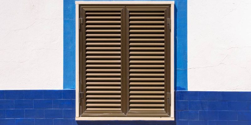 Closed wooden window shutters of an typical mediterranean house
