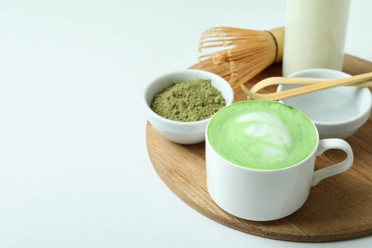 Matcha latte and accessories for making on white background