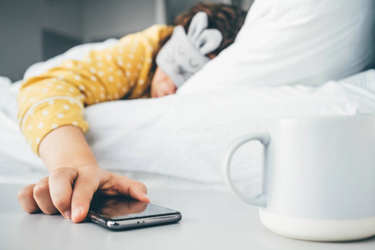 woman-in-sleeping-mask-being-woken-by-mobile-phone-2025-01-09-04-30-08-utc (1)