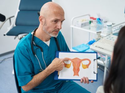 Doctor shows the patient the structure of the female system