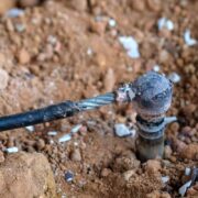 Welding copper ground wire on ground rod.